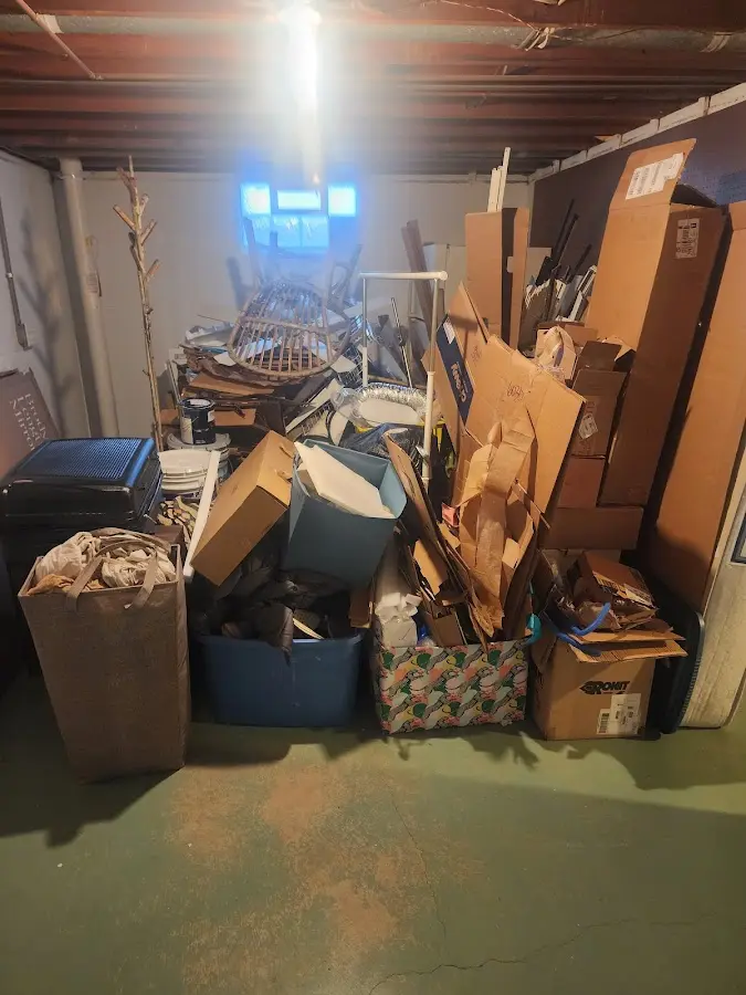 Roll-off dumpster container at job site for 2 Yard Dumpster Rental in Canfield